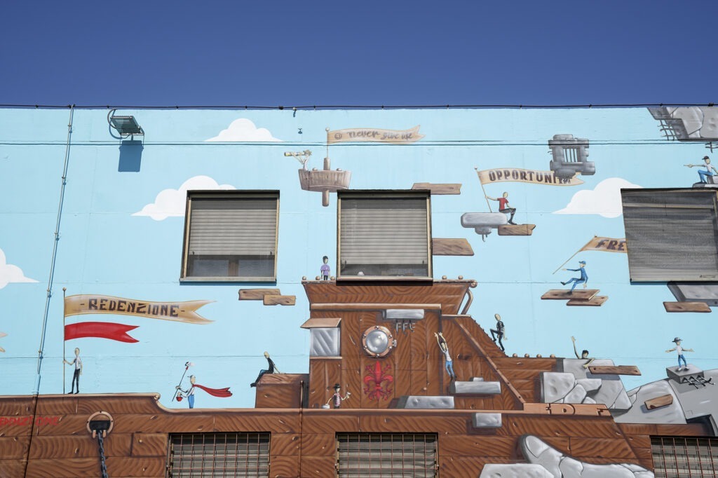 La scritta che Buca - murale al carcere di Sollicciano (FI)